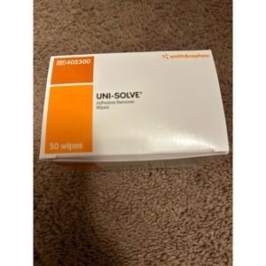 Adhesive remover wipes